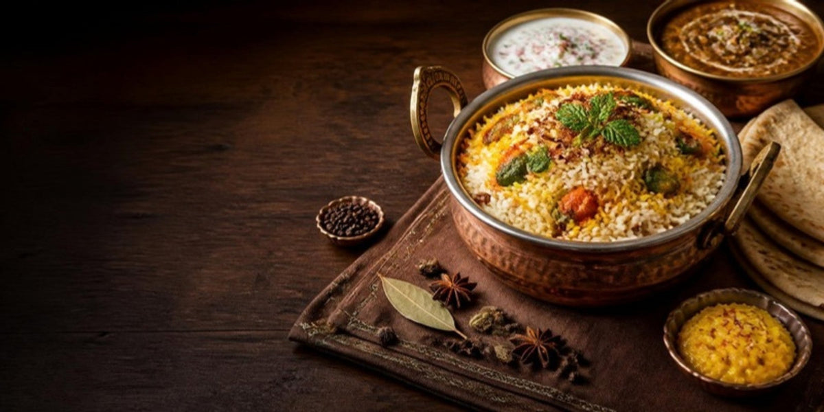 Festive vegetarian spread with vegetable dum biryani in a copper handi, raita, dal makhani and rotis, planned with Nitra